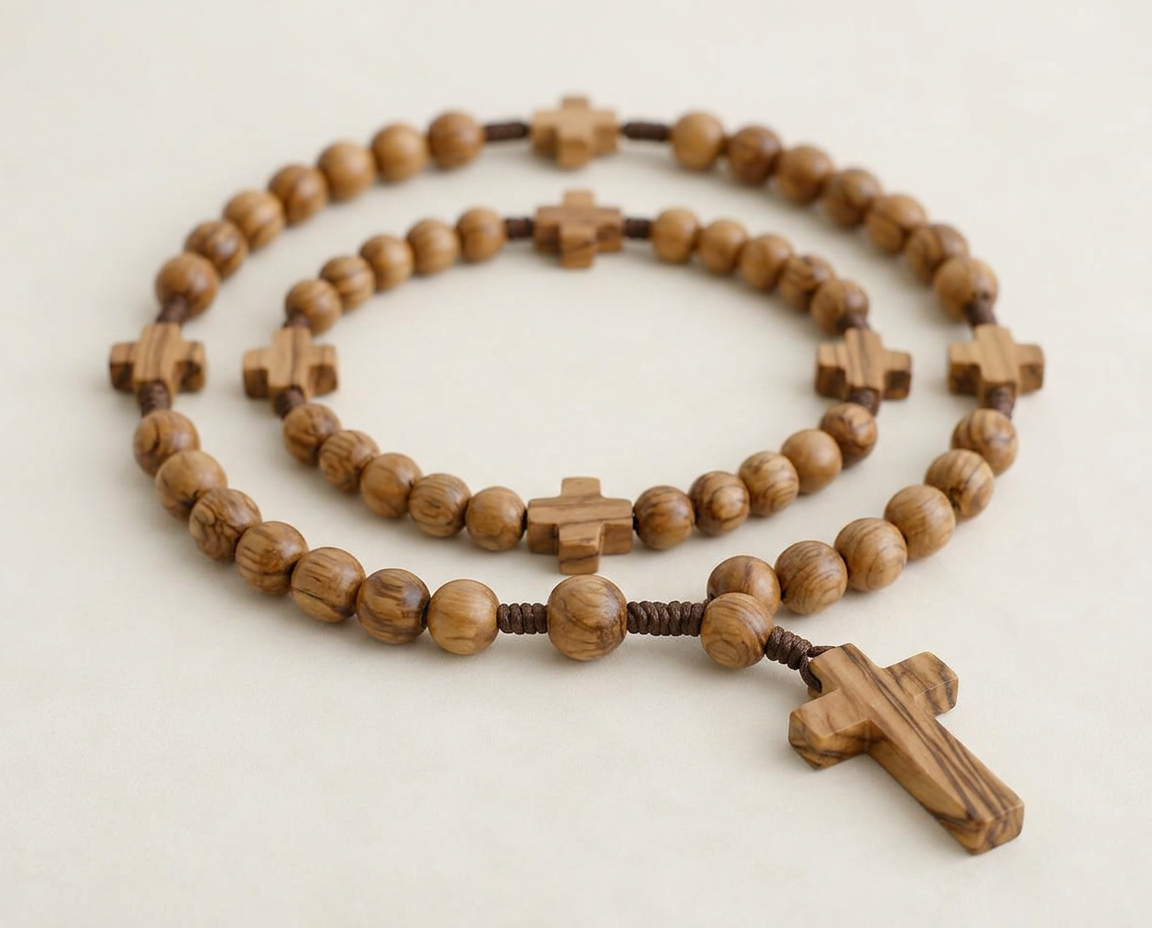 Anglican prayer beads with four cruciform divisions and a wooden cross